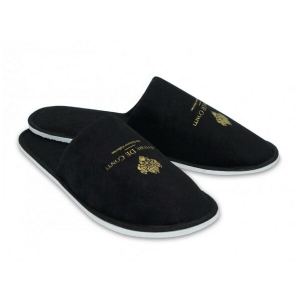 A black pair of hotel slippers from terry velour, part of Vittore De Conti hotel amenities collection