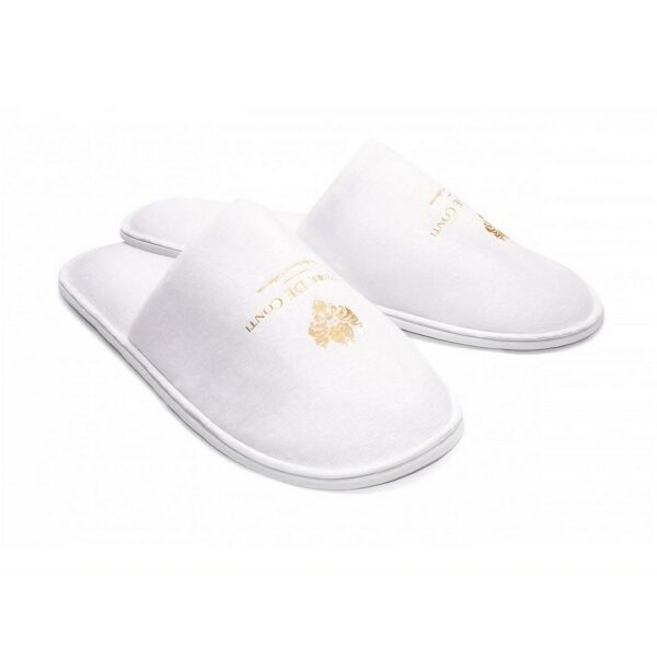 A white pair of hotel slippers from terry velour, part of Vittore De Conti hotel amenities collection