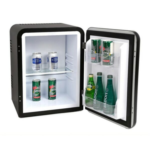 Hotel room minibar fridge, 30 liters, black color, vintage retro style, stocked with soft drinks, and water bottles. A luxury hotel room appliance for guest comfort and convenient access to refreshments, enhancing overall hotel amenities.