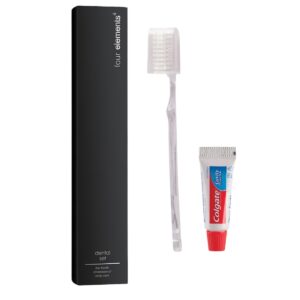 Hotel dental set Four Elements, with a clear toothbrush and mini Colgate toothpaste next to a black box, a thoughtful guest amenity and essential hotel accessory for travelers.