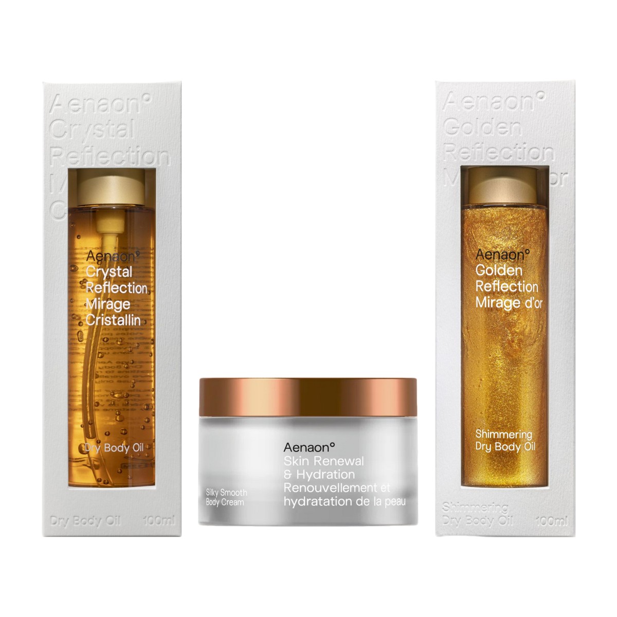Aenaon luxury skin care set with Crystal Reflection dry body oil, shimmering body oil, and skin renewal body cream, perfect summer offer for glowing hydration.