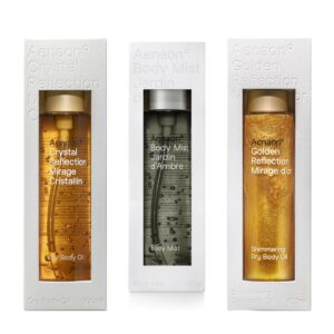 Aenaon summer skincare set with crystal dry body oil, golden shimmering body oil, and Jardin d’Ambre body mist, natural ingredients for beauty and hydration.