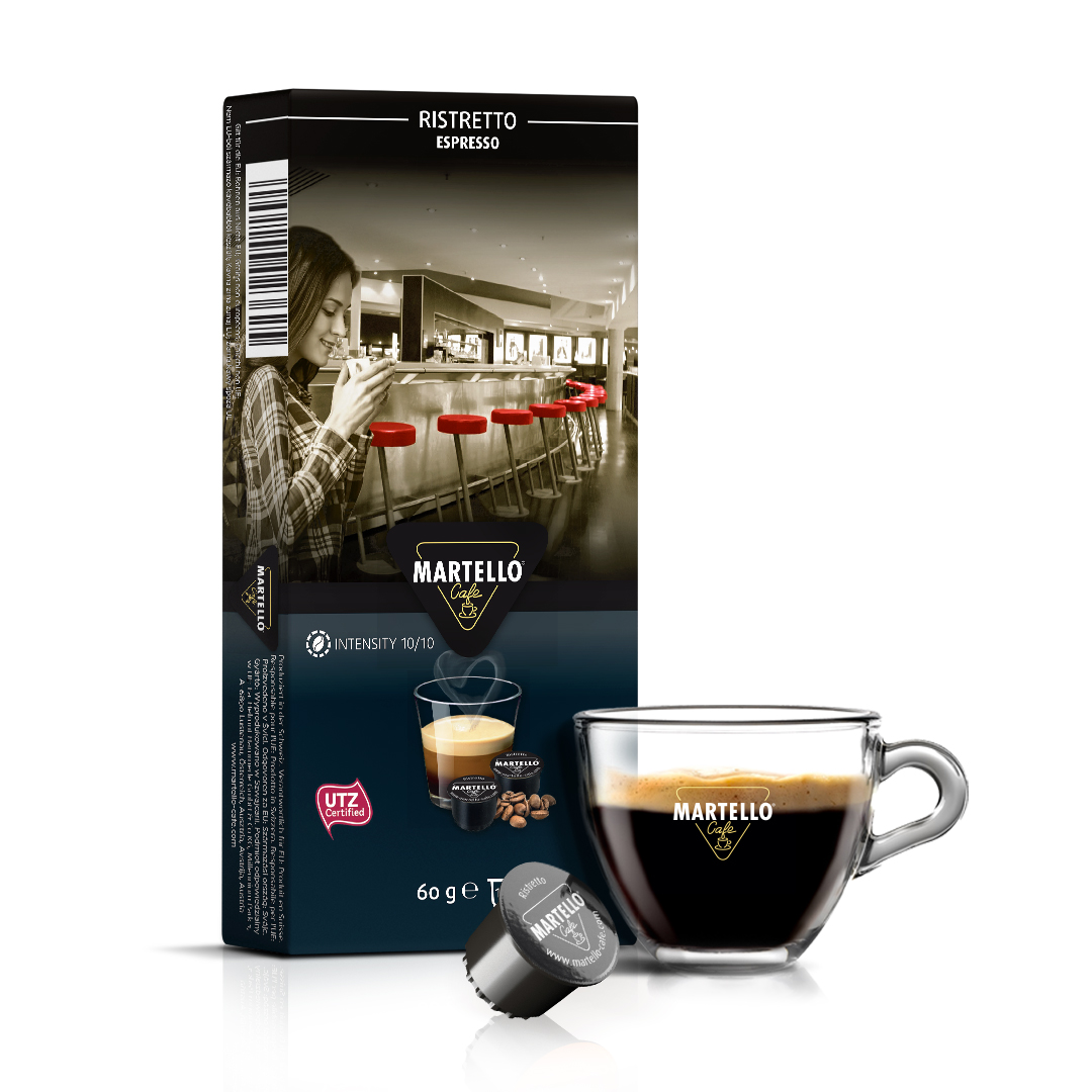Pack of Martello Ristretto espresso coffee 10 pods capsules with a clear espresso cup and coffee pod in front, showcasing rich crema. Perfect hotel coffee capsules and coffee pods for smooth, aromatic coffee experiences.