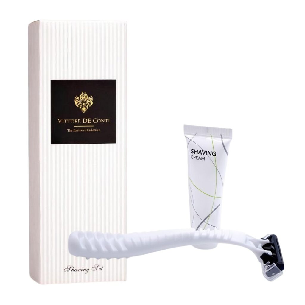 Luxury hotel shaving set Vittore De Conti with white razor and shaving cream, displayed beside a sleek box, perfect guest amenities and hotel accessories.
