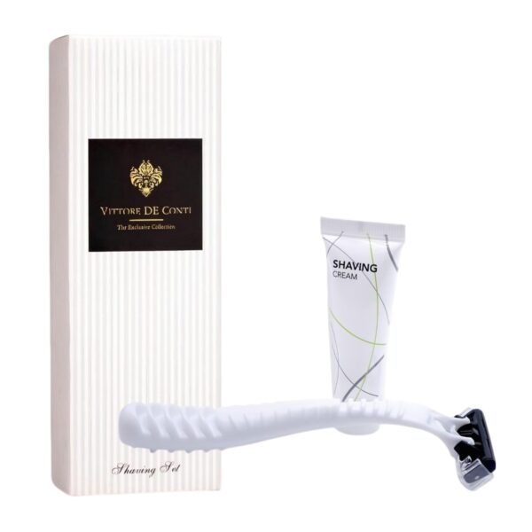Luxury hotel shaving set Vittore De Conti with white razor and shaving cream, displayed beside a sleek box, perfect guest amenities and hotel accessories.